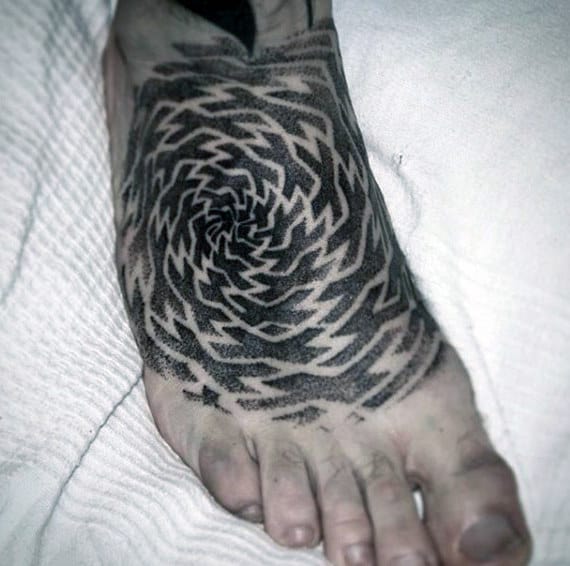 Superb Black Swirly Designs Tattoo On Foot