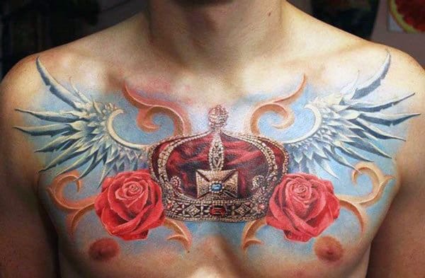 Superb Red Crown With Blue Wings Tattoo On Chest