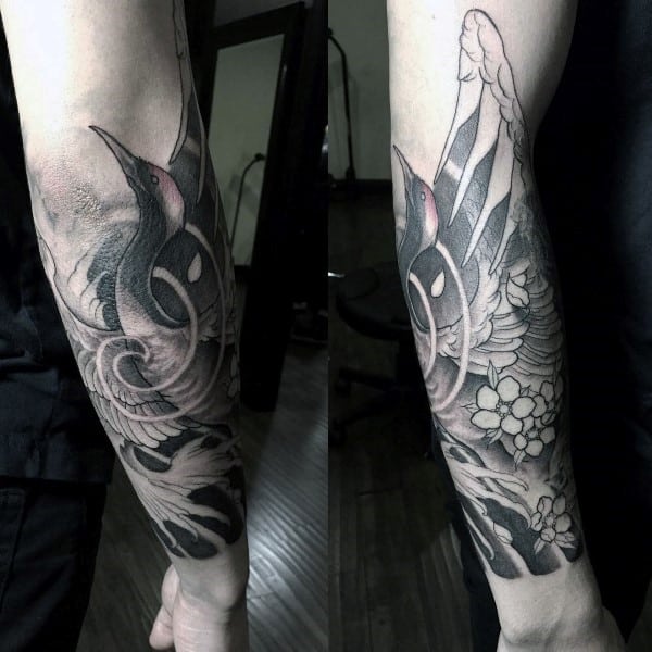 Black and grey forearm sleeve tattoo featuring an elegant swan with flowing waves and subtle cherry blossoms for a refined, artistic look