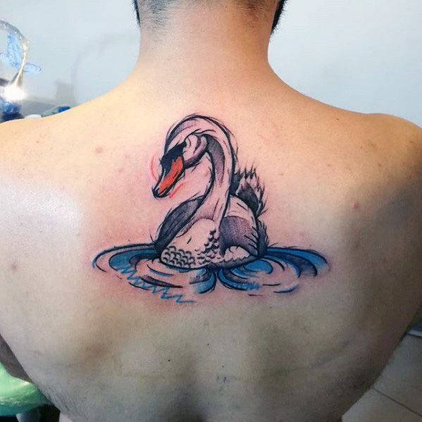 Stylized swan tattoo on upper back with bold outlines, soft shading, and blue water ripples, blending traditional and watercolor elements.