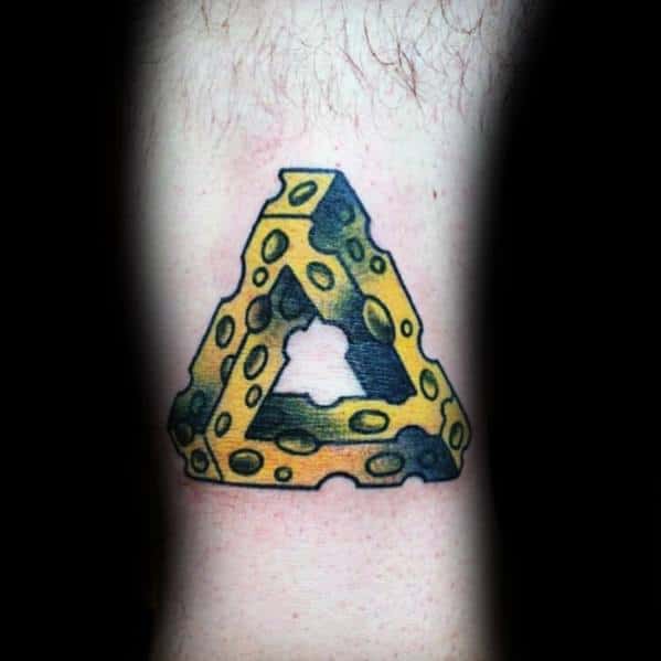 Colorful tattoo of a Penrose triangle made of Swiss cheese, featuring bold black outlines, yellow shading, and an optical illusion effect for a surreal look.