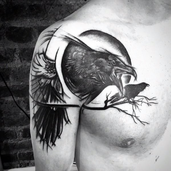 Dynamic black and grey chest and shoulder tattoo of a raven in mid-screech, perched on a branch with a full moon in the background.