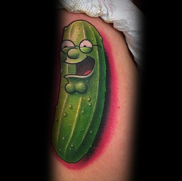 Tattoo of Peter Griffin from Family Guy transformed into a pickle, parodying "Pickle Rick," with a bright green, textured cucumber body and a humorous expression.