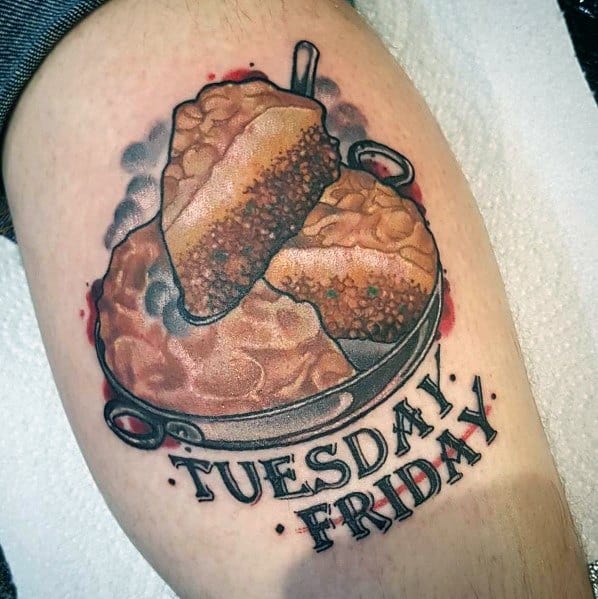Homestyle pie tattoo featuring two slices on a plate with the words “Tuesday Friday,” blending a nostalgic food theme with a personal touch