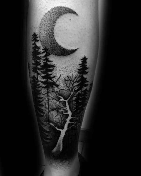Black ink forest tattoo on the leg, featuring tall pine trees, a crescent moon with dotwork shading, and a winding river for a mystical design.