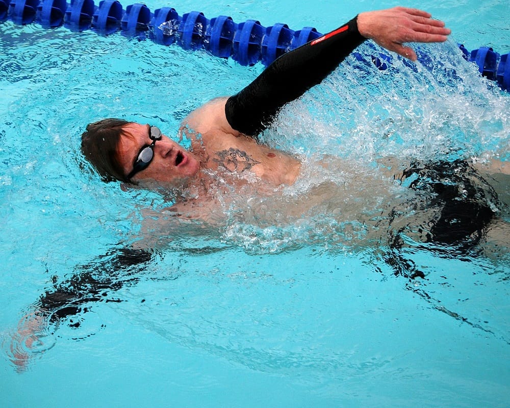 swimmer using backstroke technique