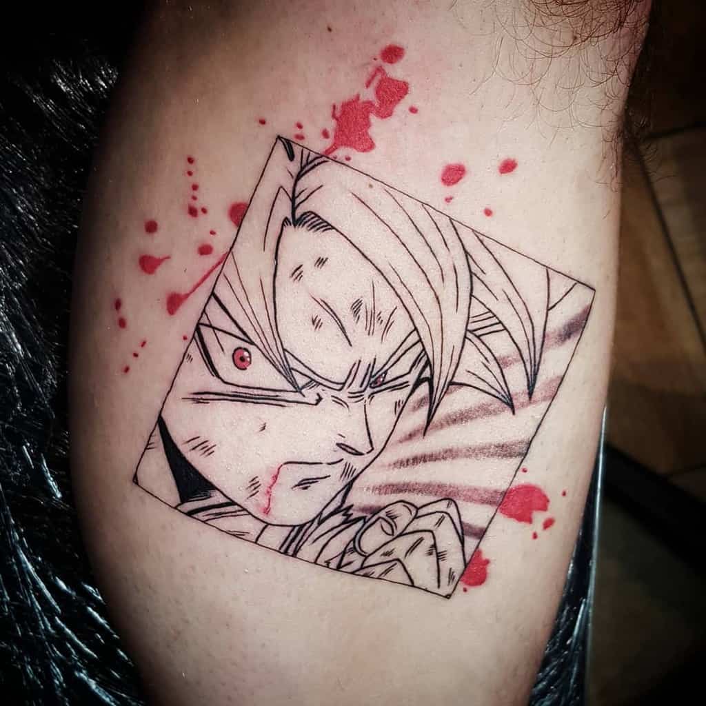 A tattoo of Goku from Dragon Ball, with a serious expression and blood splatters, framed in a square with sharp, dynamic lines.