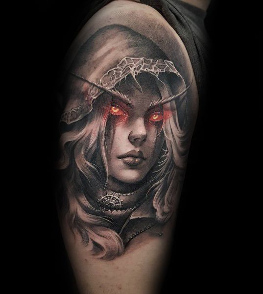 Realistic black and grey tattoo of Sylvanas Windrunner from World of Warcraft, featuring glowing red eyes, intricate shading, and a detailed hood, inked on the upper arm.