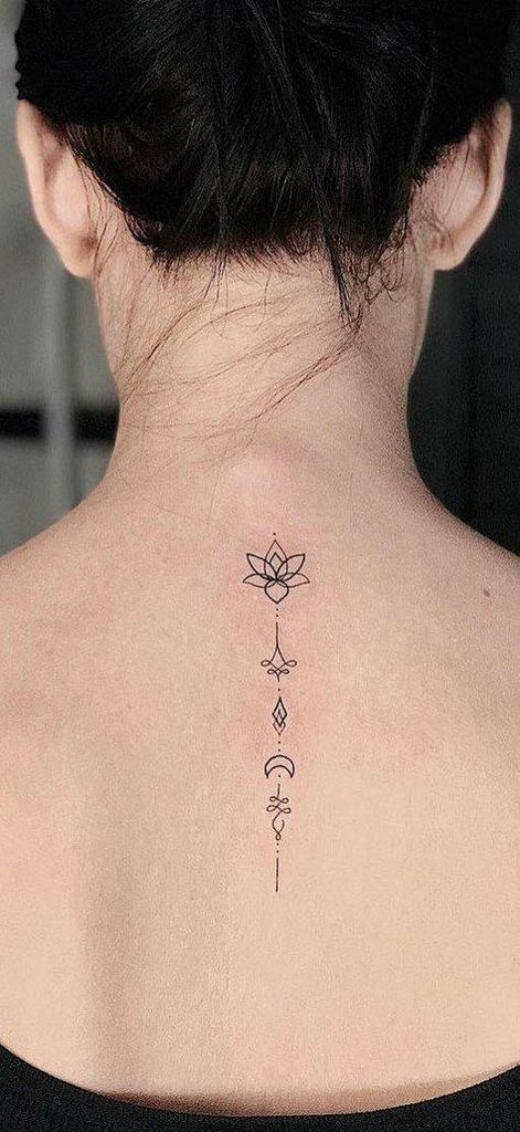 Unalome tattoo with a lotus on the upper back, symbolizing spiritual growth, enlightenment, and the journey toward inner balance.