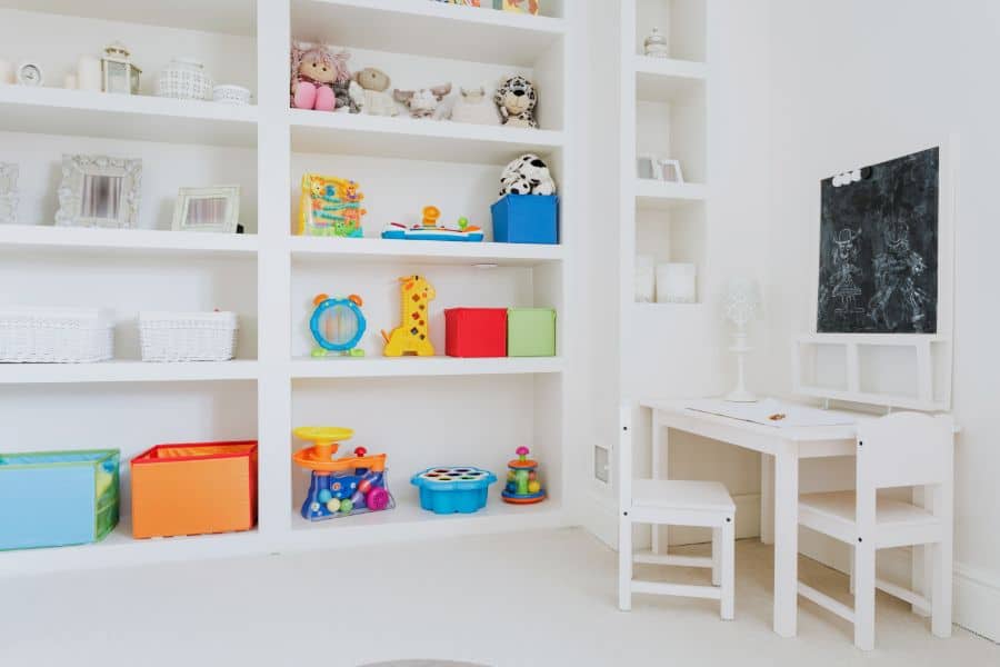 corner table and chairs in kids playroom with lots of storage