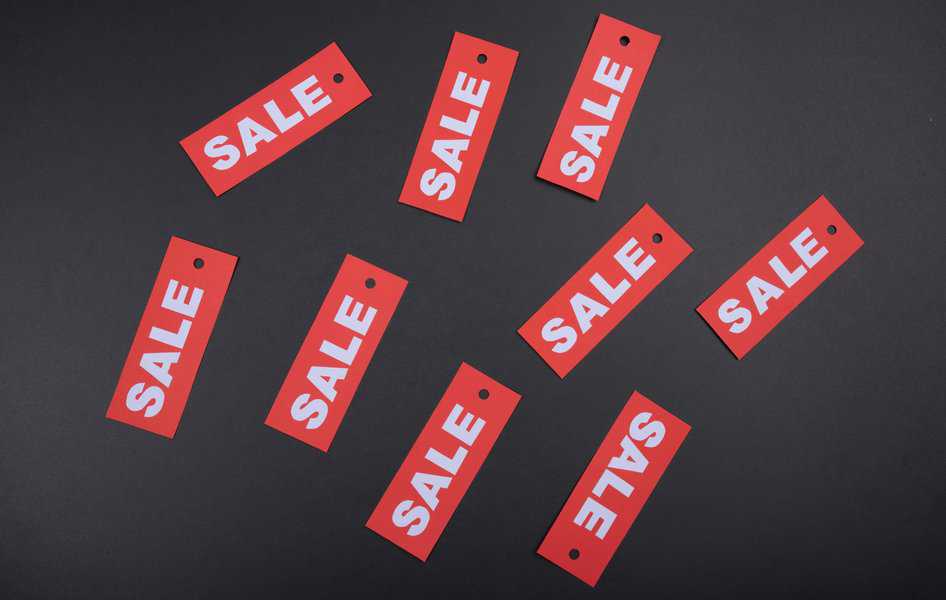Red Sales tags on a black background