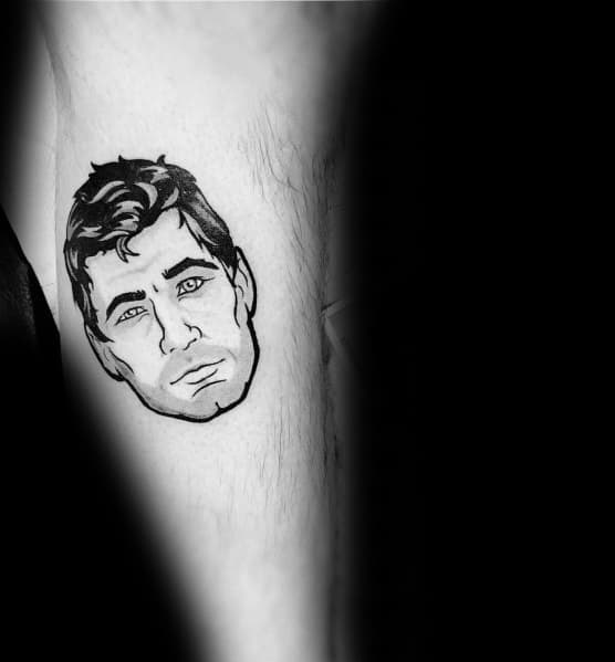 Minimalist black ink Archer tattoo featuring his face with expressive eyes and messy hair, capturing his signature smirk.