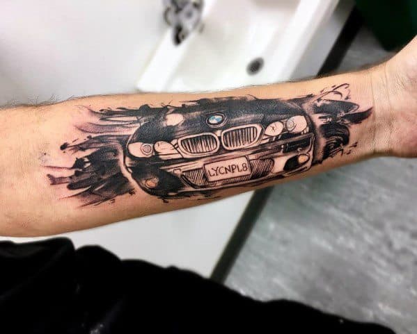 Bold BMW front grille tattoo on forearm, featuring a ripped skin effect for a striking and dynamic automotive-inspired design.