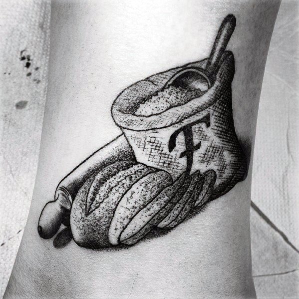 Realistic black and gray tattoo of a sack of flour with a wooden spoon, a rolling pin, and fresh bread, featuring fine shading for depth and texture.