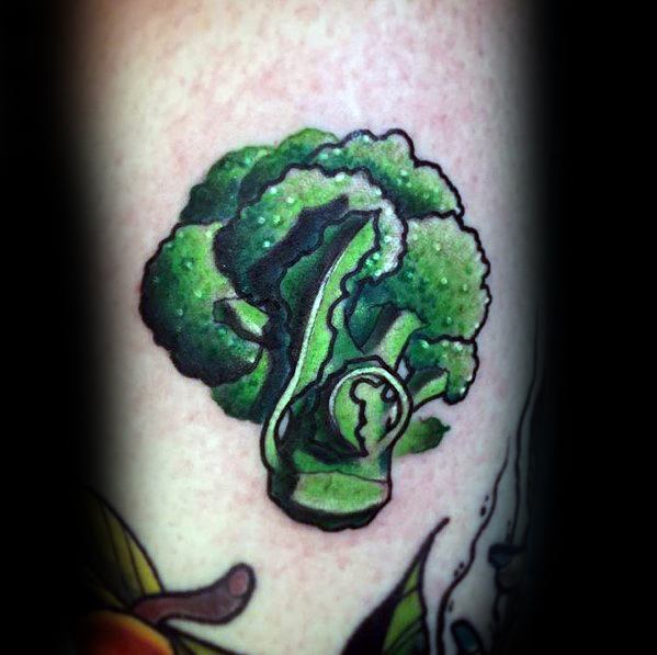 Vibrant broccoli tattoo with a surreal twist, featuring rich green shading and a keyhole detail for a creative and mysterious design.