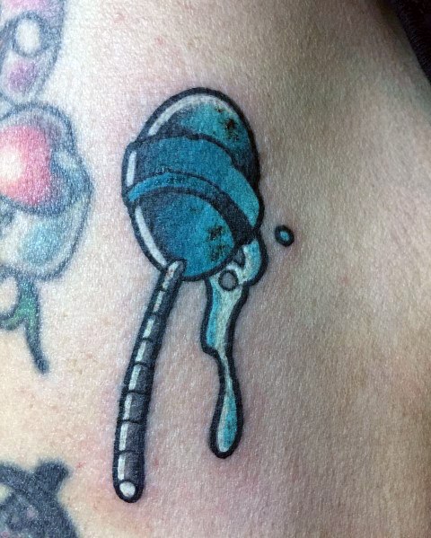 Cartoon-style blue lollipop tattoo with a melting effect, featuring bold outlines and a playful, slightly distressed look.