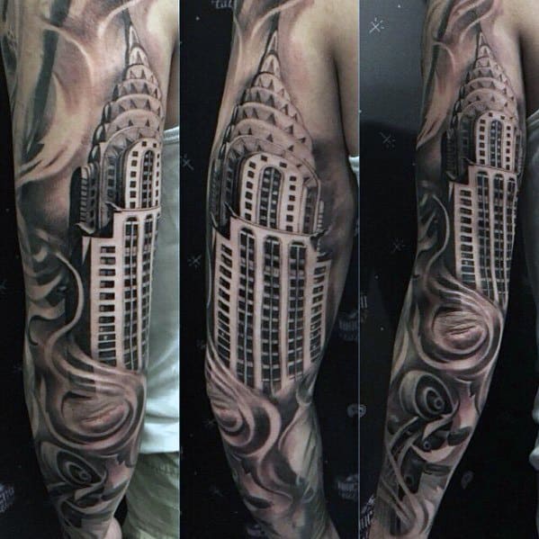 Black and grey sleeve tattoo featuring the Chrysler Building surrounded by dynamic swirls for a bold, flowing, and dramatic effect.