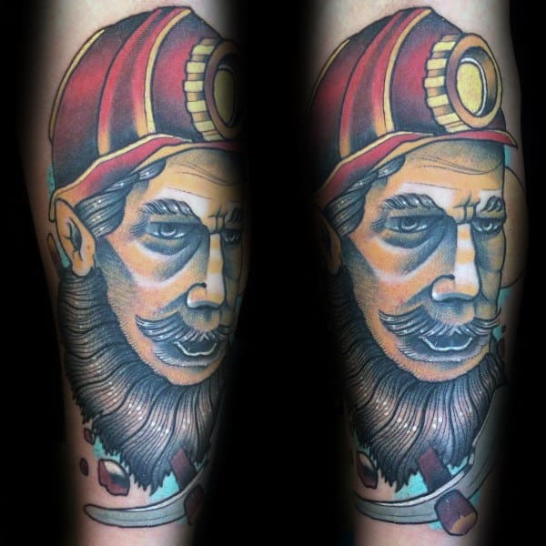 Colorful tattoo of a vintage-style coal miner with a red helmet, thick beard, and intense gaze, done in bold traditional tones.
