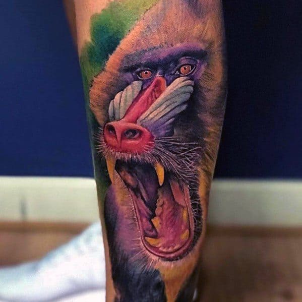 Hyper-realistic baboon tattoo with vivid colors, intense shading, and a fierce open-mouthed expression, creating a bold and dynamic leg design.