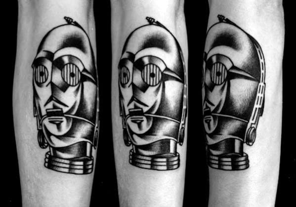 Bold black and grey C-3PO tattoo with high-contrast shading and a traditional style, giving it a striking, vintage sci-fi look.