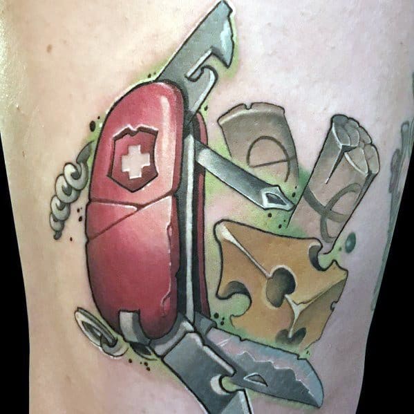 Colorful tattoo of a Swiss Army knife with an open blade, surrounded by a wedge of Swiss cheese and wine corks, featuring bold outlines and dynamic shading.