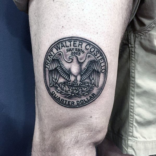 Custom quarter dollar tattoo featuring an eagle design and personalized name and date, with detailed shading for a realistic effect.