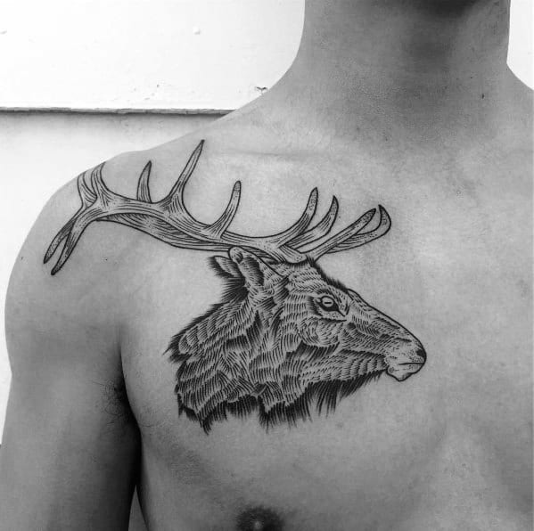 Minimalist black ink elk tattoo on the chest, featuring fine linework, bold antlers, and intricate fur detailing for a sleek and artistic design.