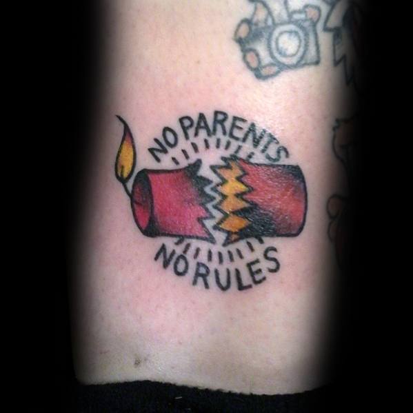 Tattoo of a red firecracker with a lit fuse, bursting open, surrounded by the phrase "No Parents, No Rules" in bold lettering for a rebellious look.