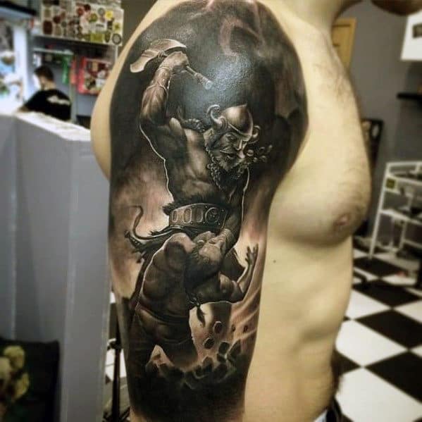 Tattoo of a Viking warrior in battle on a person's upper arm