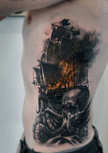 Realistic side tattoo featuring a burning pirate ship, a menacing skull, and tentacles emerging from the depths for a dark nautical theme.