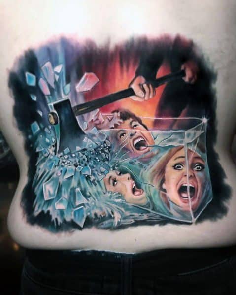 Color horror tattoo depicting a terrifying scene of an axe smashing through glass, with screaming faces trapped inside for a dramatic and intense effect.