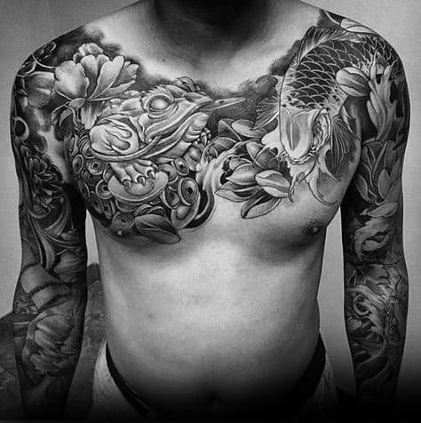 Black and grey Japanese-style chest and sleeve tattoo featuring a large frog with gold coins, a koi fish, and intricate floral and wave patterns.