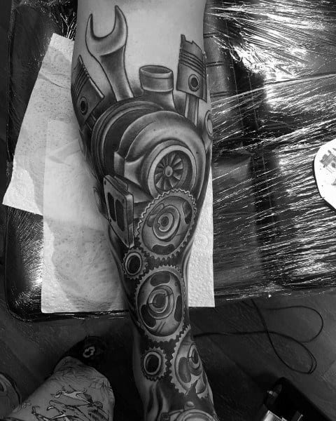 Realistic **mechanical-themed** tattoo sleeve featuring a turbocharger, gears, pistons, and wrenches, symbolizing engineering, power, and automotive passion.