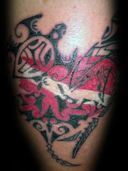 Tattoo of a tribal-style sea turtle with a red and white dive flag integrated into its design, symbolizing a love for diving and marine life.