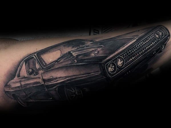 Realistic black and grey Dodge muscle car tattoo, featuring detailed shading and a bold front grille for a classic and powerful design.