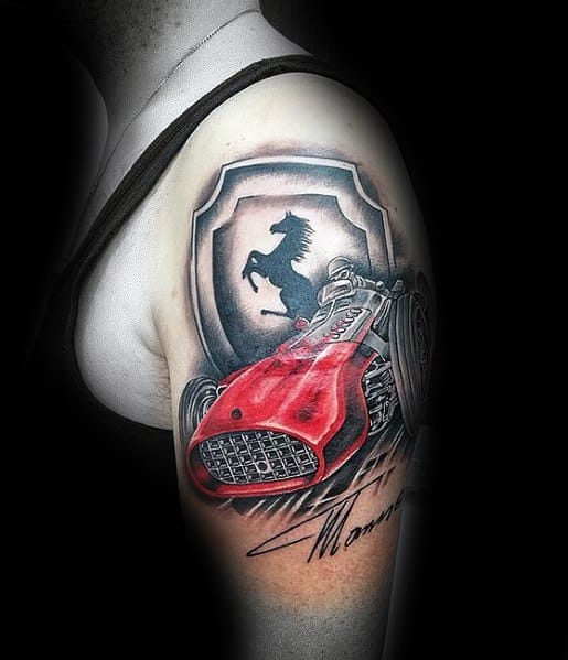 Striking tattoo of a vintage red Ferrari race car with signature and emblem, symbolizing classic racing heritage and style on man's upper arm.
