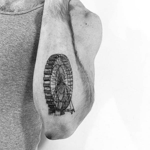 Fine-line Ferris wheel tattoo on the arm, featuring intricate details and realistic perspective, creating a delicate and precise architectural design.