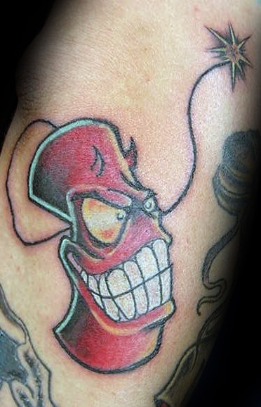 Tattoo of an anthropomorphic firecracker with a mischievous grin, devilish horns, and a lit fuse, designed in a bold and animated style.