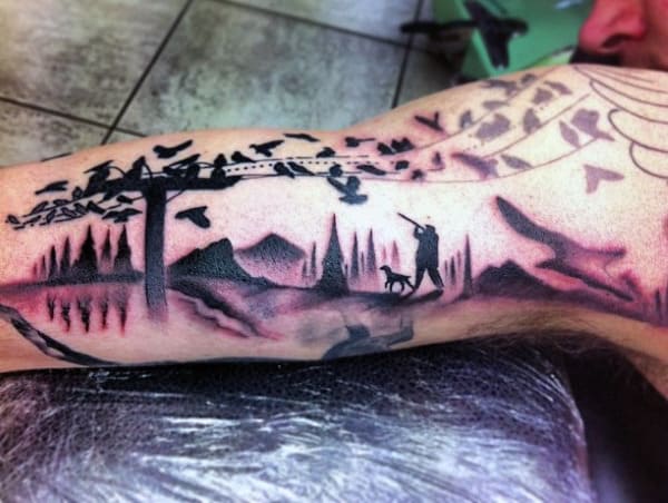 Tattoo Hunter On Man's Bicep