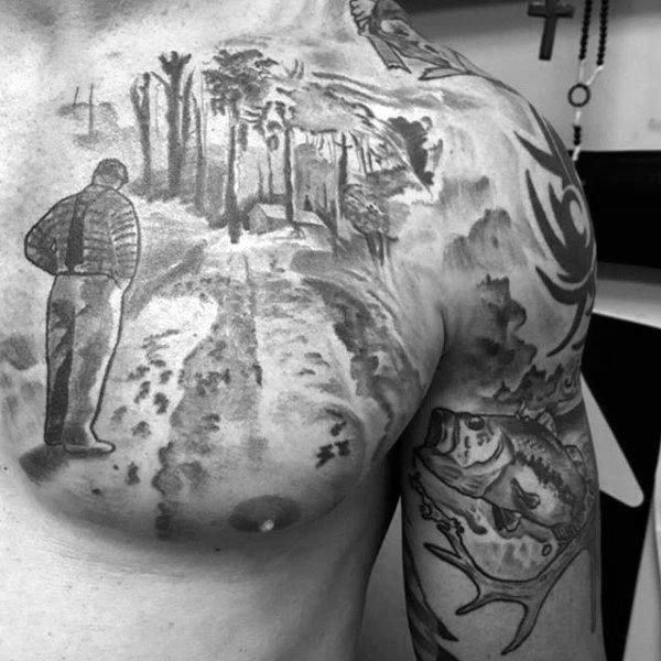 Black and gray chest tattoo of a man standing on a dirt path through a wooded landscape, blending into tribal and wildlife designs.