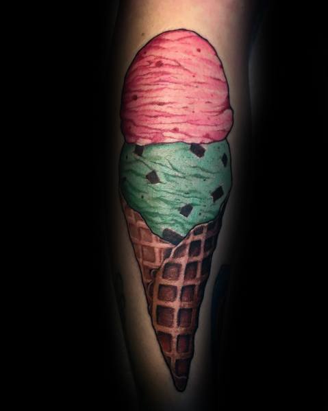 Realistic tattoo of a double-scoop ice cream cone featuring strawberry and mint chocolate chip flavors, with detailed shading and texture for a lifelike look.