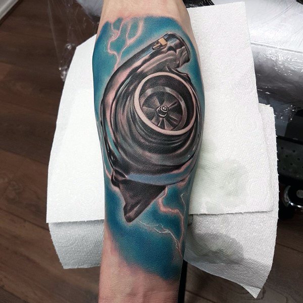 Realistic **turbocharger** tattoo on the forearm with vibrant **blue lightning effects**, symbolizing speed, power, and high-performance automotive passion.