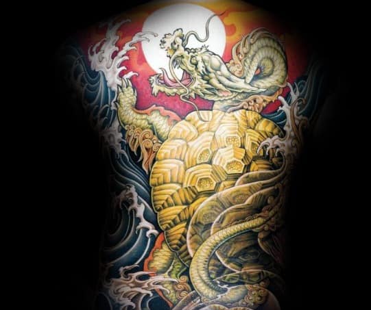 Japanese-style full-back tattoo featuring a golden turtle, a dragon, crashing waves, and a glowing sun, symbolizing strength, wisdom, and longevity.