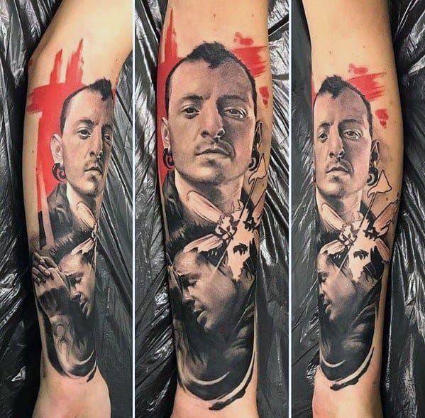 Realistic tattoo of Chester Bennington with the Hybrid Theory soldier, bold red brushstrokes, and detailed shading for a powerful tribute.