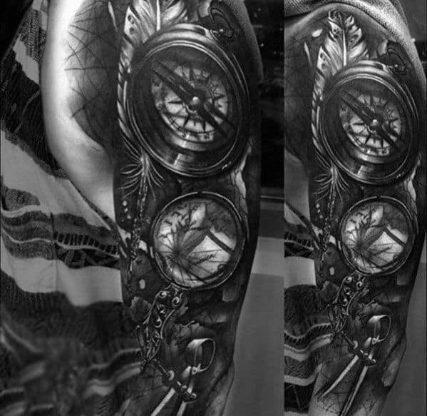 Tattoo featuring a magnifying glass, compass, map, and key, designed with deep shading for a bold and intricate adventure-themed sleeve.