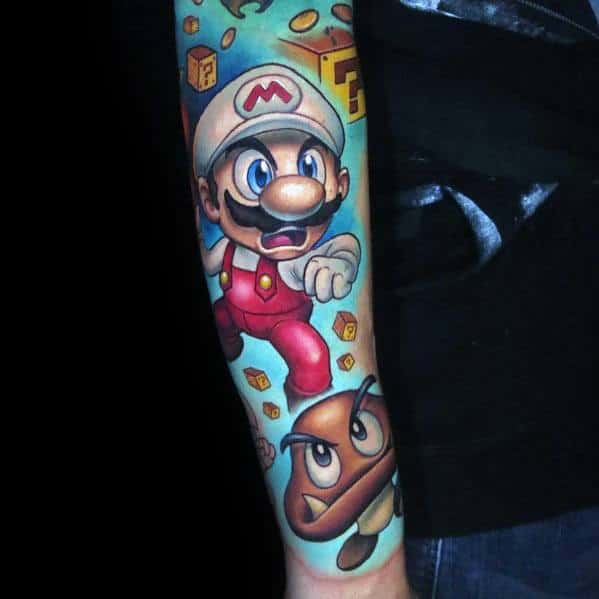 Vibrant *Super Mario* tattoo featuring Fire Mario in action, surrounded by question blocks, coins, and a Goomba for a dynamic gaming-inspired design.