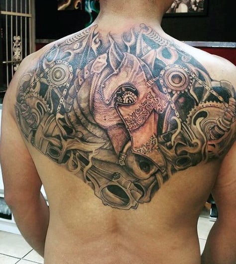Man with a large, intricate mechanical-themed tattoo covering his upper back
