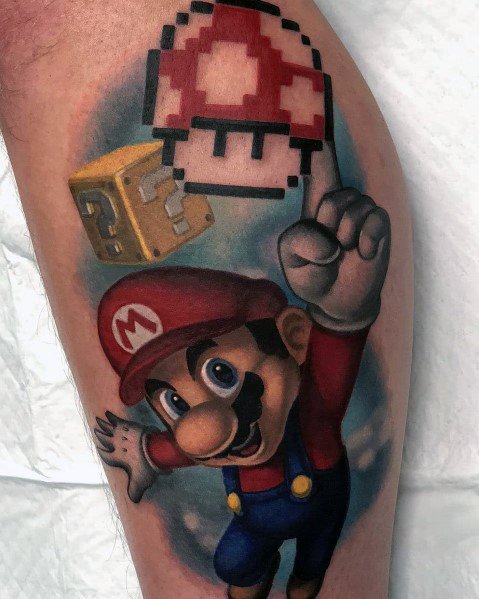 Vibrant *Super Mario* tattoo featuring Mario reaching for a pixelated Super Mushroom with a question block, blending retro and modern gaming styles.