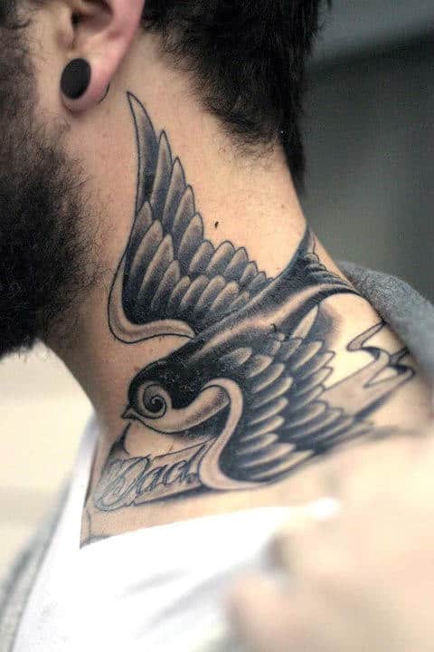 Tattooed neck featuring a swallow in flight and script below