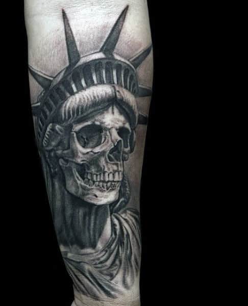 Tattoo Of Skull Face Statue Of Liberty On Mens Wrist